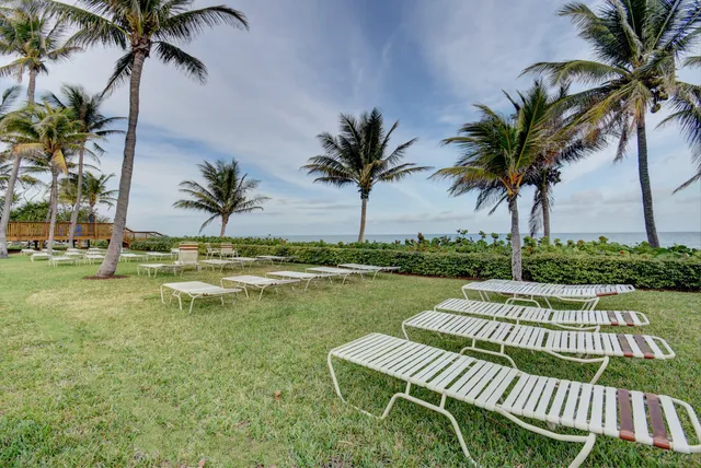 a view of swimming pool with a table and chairs