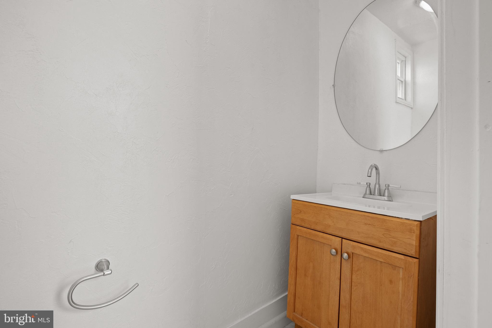 958 East Princess Street York, PA 17403 - Photo 12 of 27 a bathroom with a toilet sink and mirror