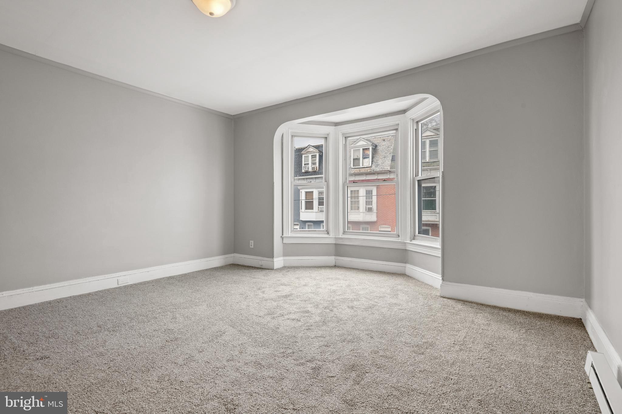 958 East Princess Street York, PA 17403 - Photo 14 of 27 an empty room with windows and cabinet
