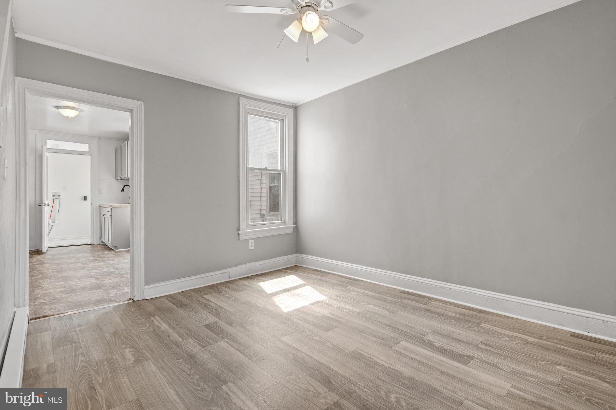 958 East Princess Street York, PA 17403 - Photo 5 of 27 wooden floor in an empty room with a window