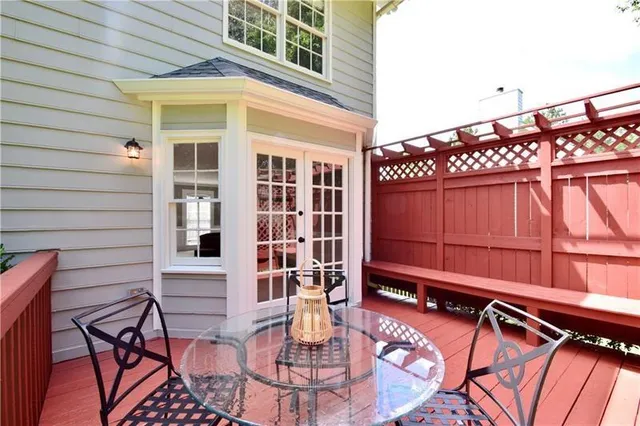 a view of a chairs and table in the patio