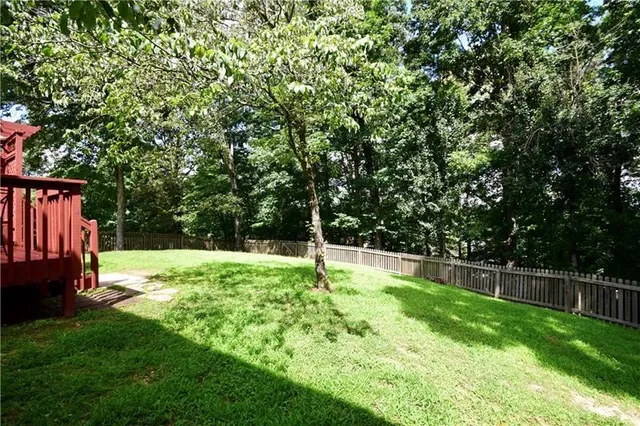 a view of backyard with garden and trees