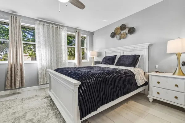 a bedroom with a large bed and a window