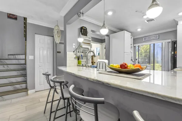 a kitchen with a table and chairs
