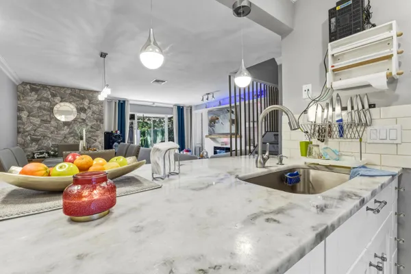 a view of a kitchen with a sink and toys