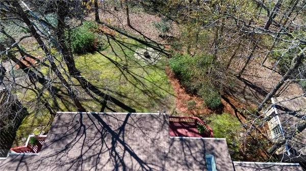 an aerial view of a town with trees