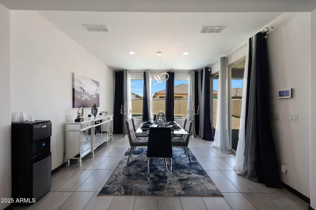 a kitchen with a refrigerator and a sink