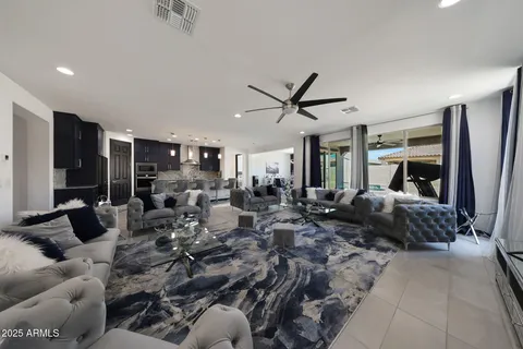 a living room with furniture gym equipment and a large window