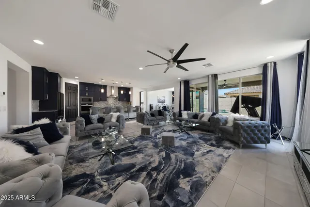 a living room with furniture gym equipment and a large window