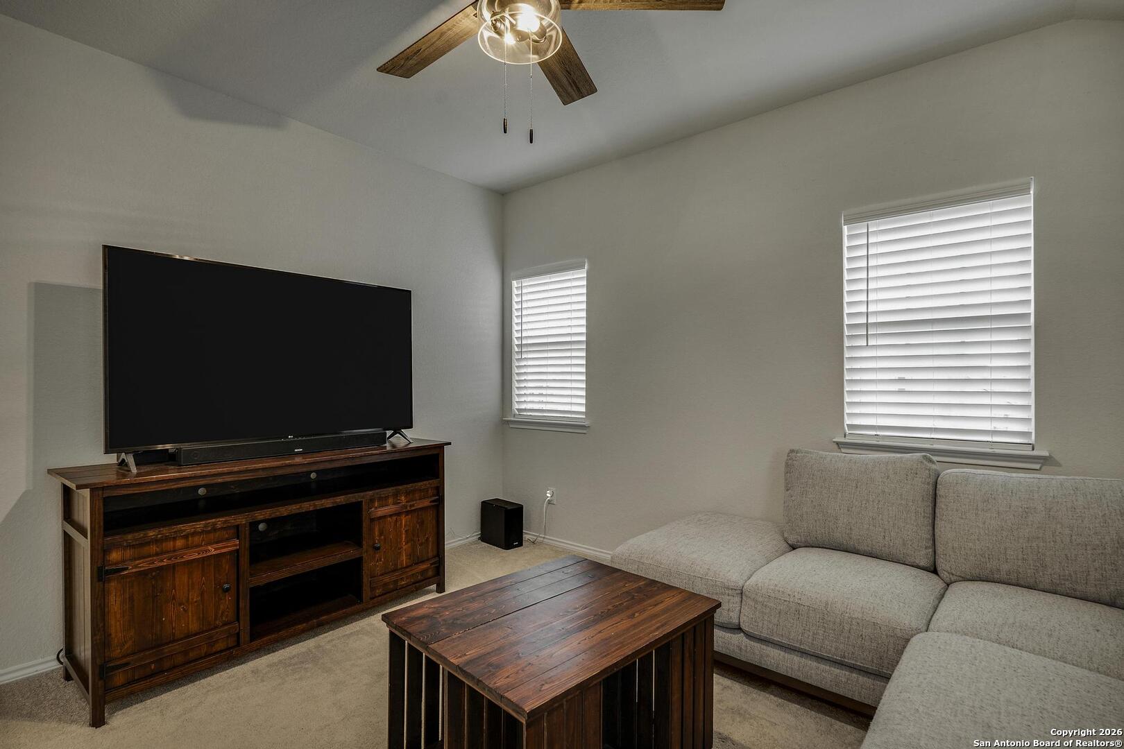 151 Inverness Boerne, TX 78015 - Photo 16 of 31 a living room with furniture and a flat screen tv