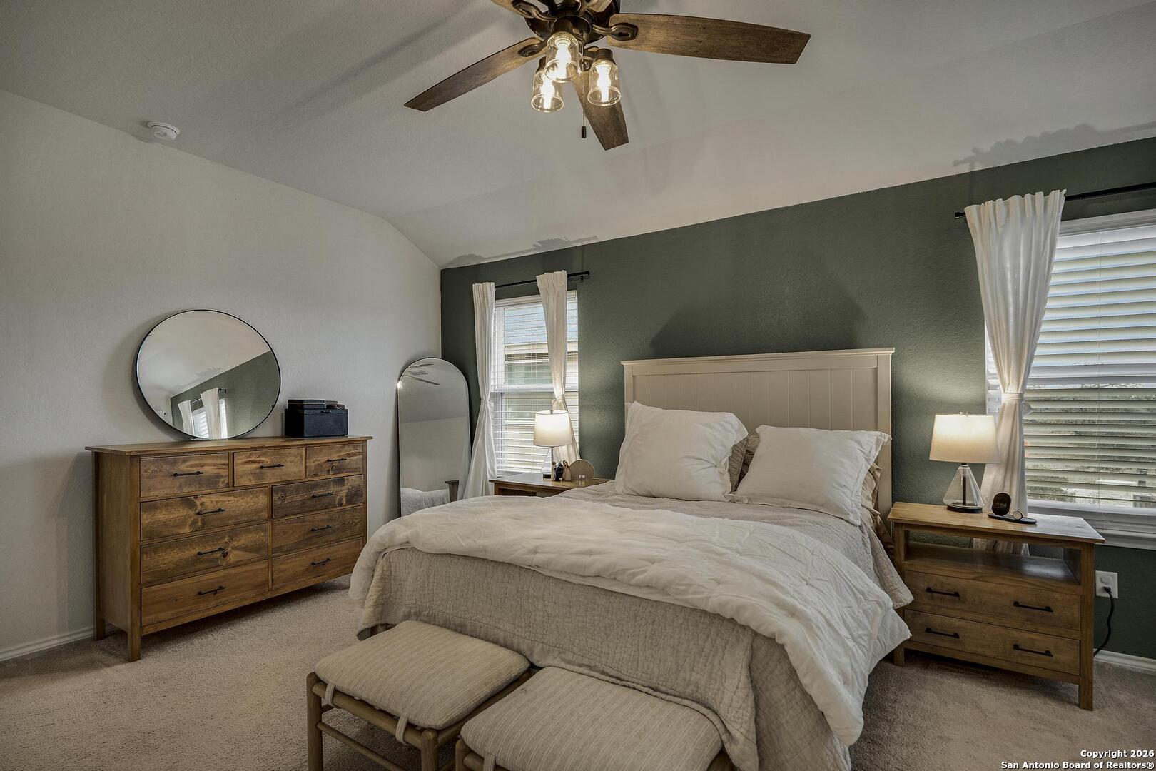 151 Inverness Boerne, TX 78015 - Photo 18 of 31 a bedroom with a bed and ceiling fan