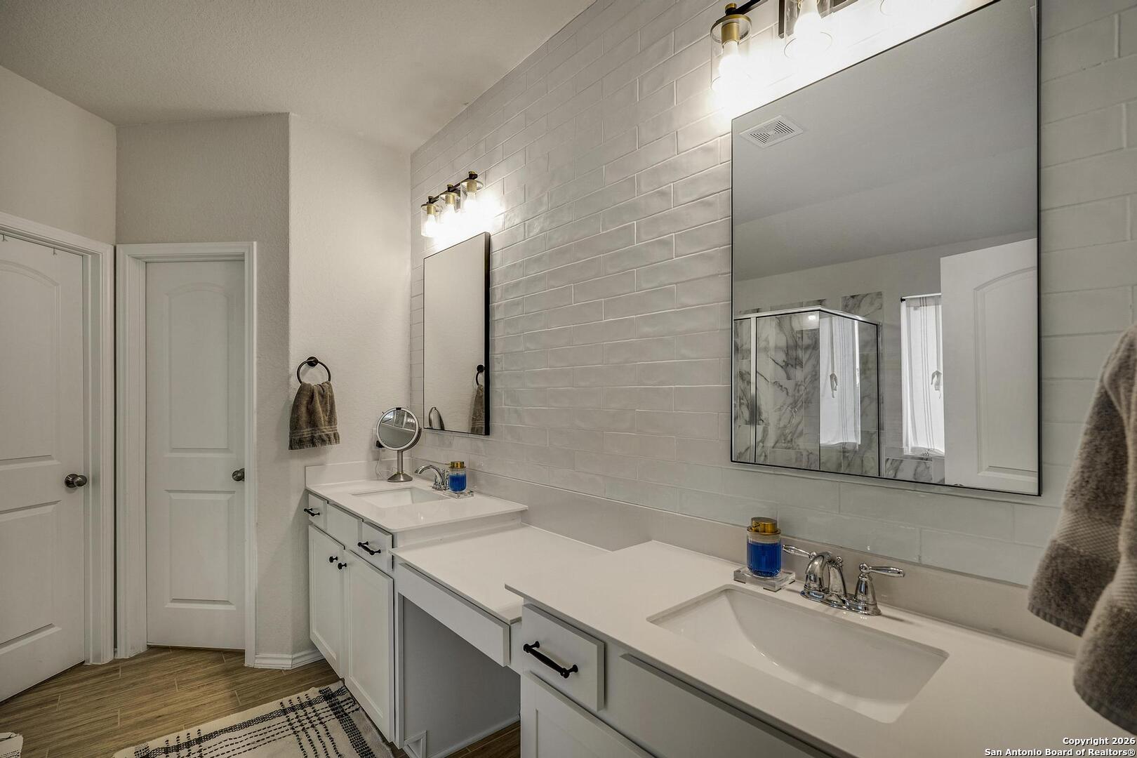 151 Inverness Boerne, TX 78015 - Photo 19 of 31 a bathroom with a sink and a mirror