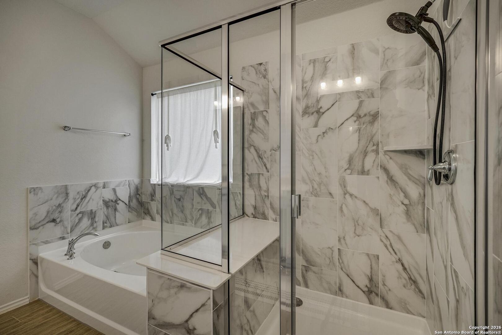 151 Inverness Boerne, TX 78015 - Photo 20 of 31 a bathroom with a bath tub and shower