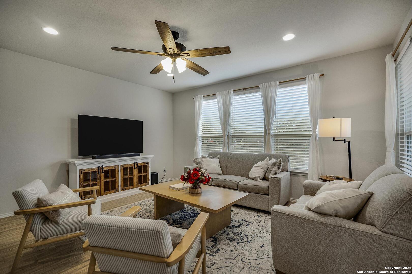151 Inverness Boerne, TX 78015 - Photo 2 of 31 a living room with furniture and a flat screen tv