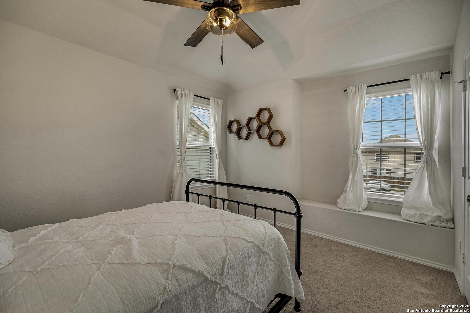 151 Inverness Boerne, TX 78015 - Photo 21 of 31 a bedroom with a bed and a window