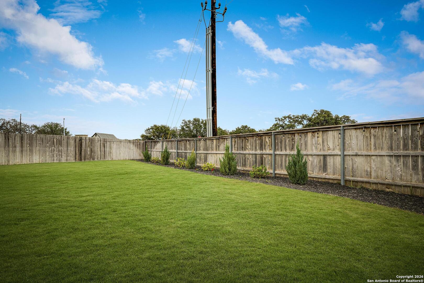 151 Inverness Boerne, TX 78015 - Photo 26 of 31 a view of a backyard with a garden
