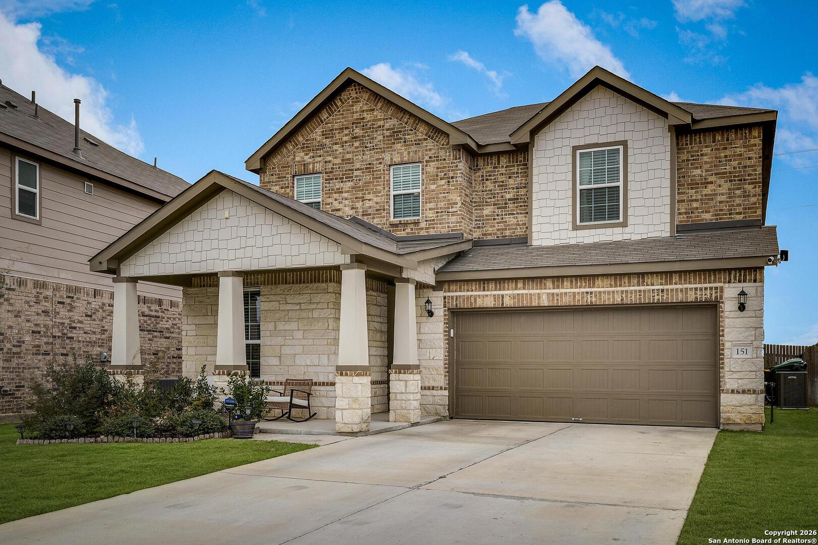 151 Inverness Boerne, TX 78015 - Photo 30 of 31 a front view of a house with a yard and garage