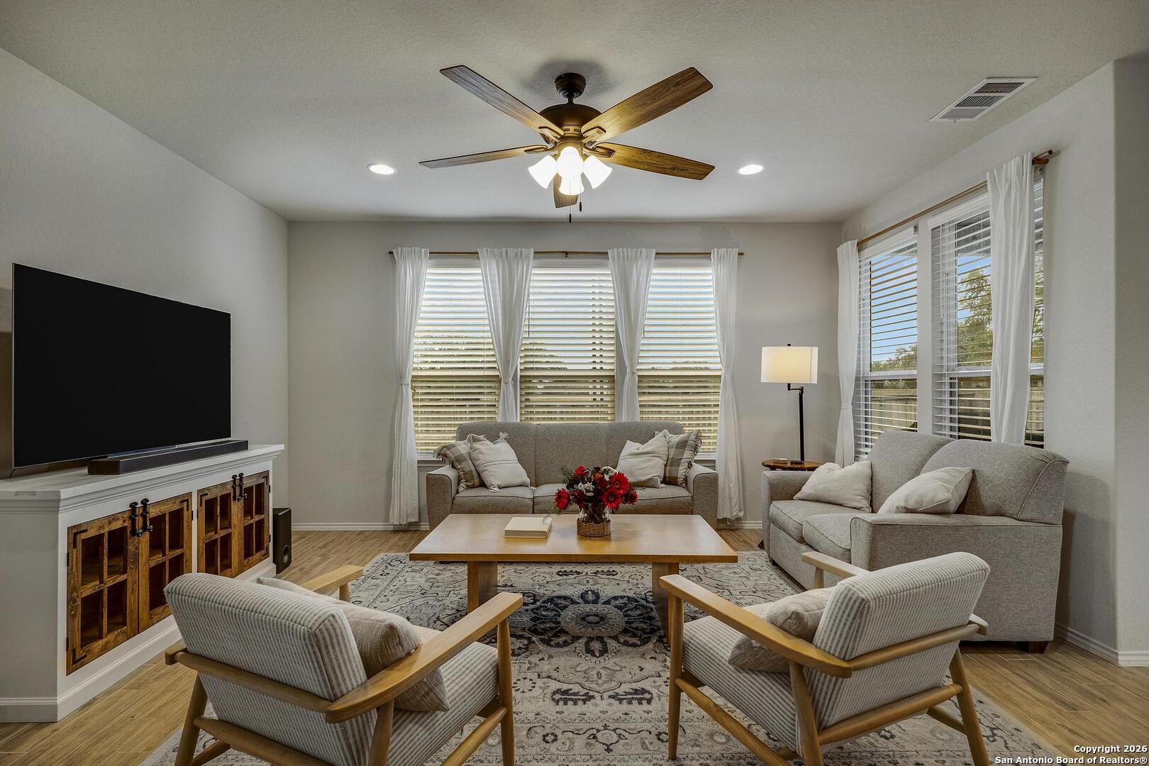 151 Inverness Boerne, TX 78015 - Photo 3 of 31 a living room with furniture and a flat screen tv