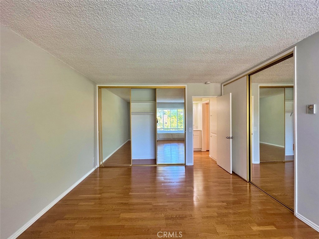 5625 North Sumner Way, Unit 212 Culver City, CA 90230 - Photo 17 of 39 a view of an empty room with wooden floor