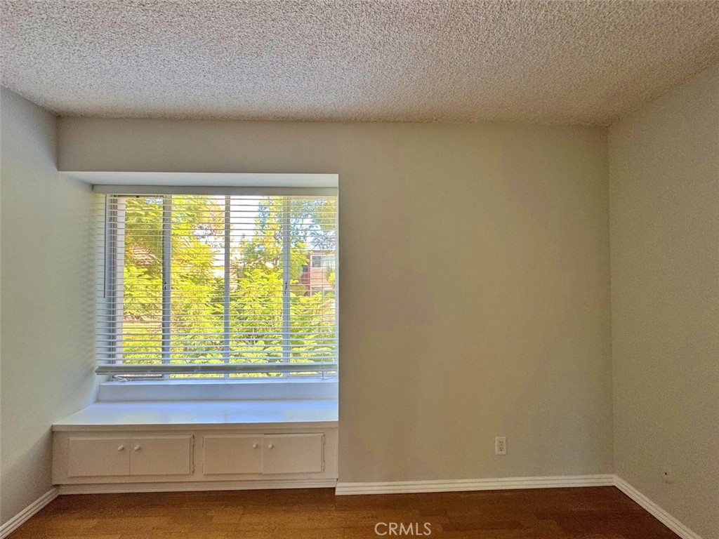 5625 North Sumner Way, Unit 212 Culver City, CA 90230 - Photo 18 of 39 a view of a room with wooden floor and a window