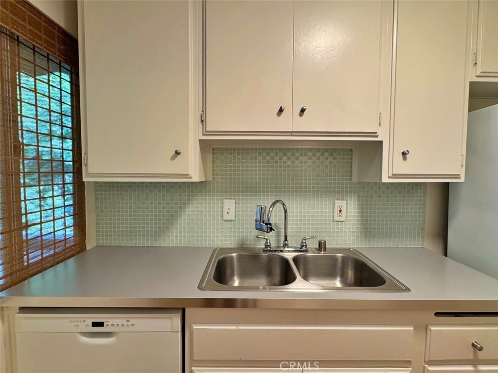 5625 North Sumner Way, Unit 212 Culver City, CA 90230 - Photo 24 of 39 a kitchen with white cabinets and a sink