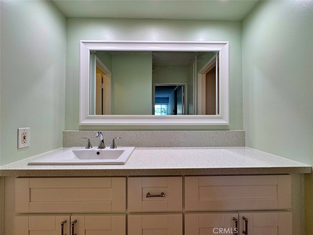 5625 North Sumner Way, Unit 212 Culver City, CA 90230 - Photo 32 of 39 a bathroom with a sink and a mirror