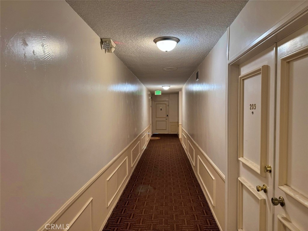 5625 North Sumner Way, Unit 212 Culver City, CA 90230 - Photo 37 of 39 a view of a hallway with wooden floor
