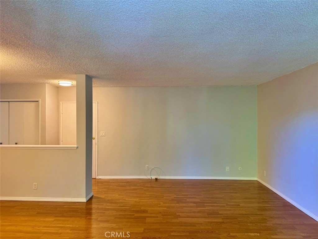 5625 North Sumner Way, Unit 212 Culver City, CA 90230 - Photo 5 of 39 a view of empty room with wooden floor