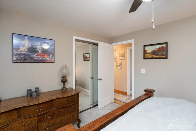 a bedroom with a bed and a dresser