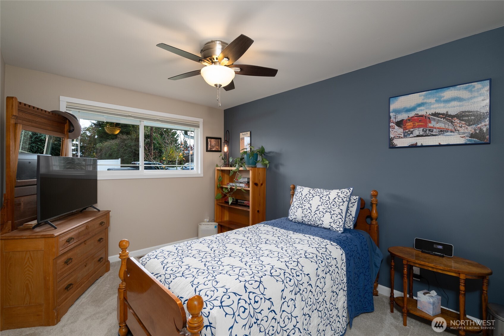 2304 E Avenue Anacortes, WA 98221 - Photo 15 of 26 a bedroom with furniture and flat screen tv