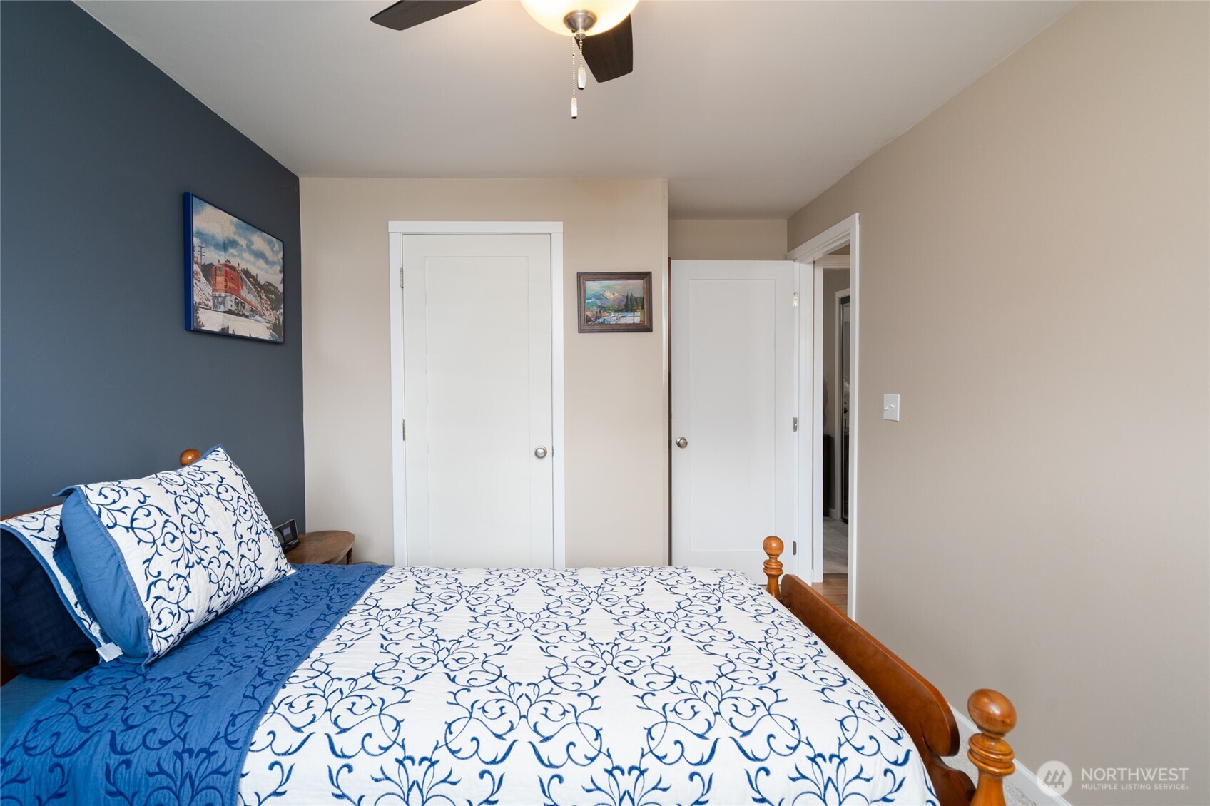 2304 E Avenue Anacortes, WA 98221 - Photo 16 of 26 a bedroom with bed and wooden floor