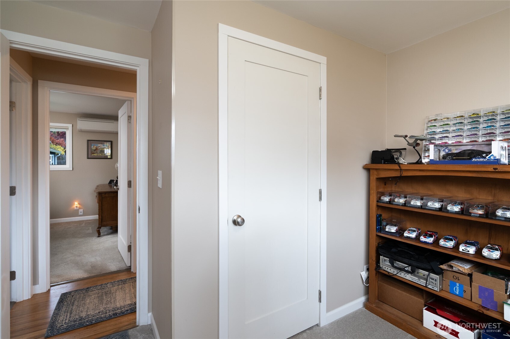 2304 E Avenue Anacortes, WA 98221 - Photo 18 of 26 a view of a hallway with wooden shelves
