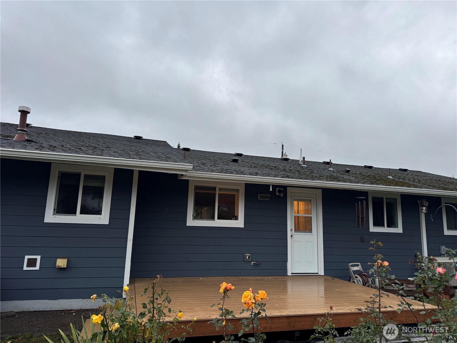 2304 E Avenue Anacortes, WA 98221 - Photo 21 of 26 a view of a house with a backyard