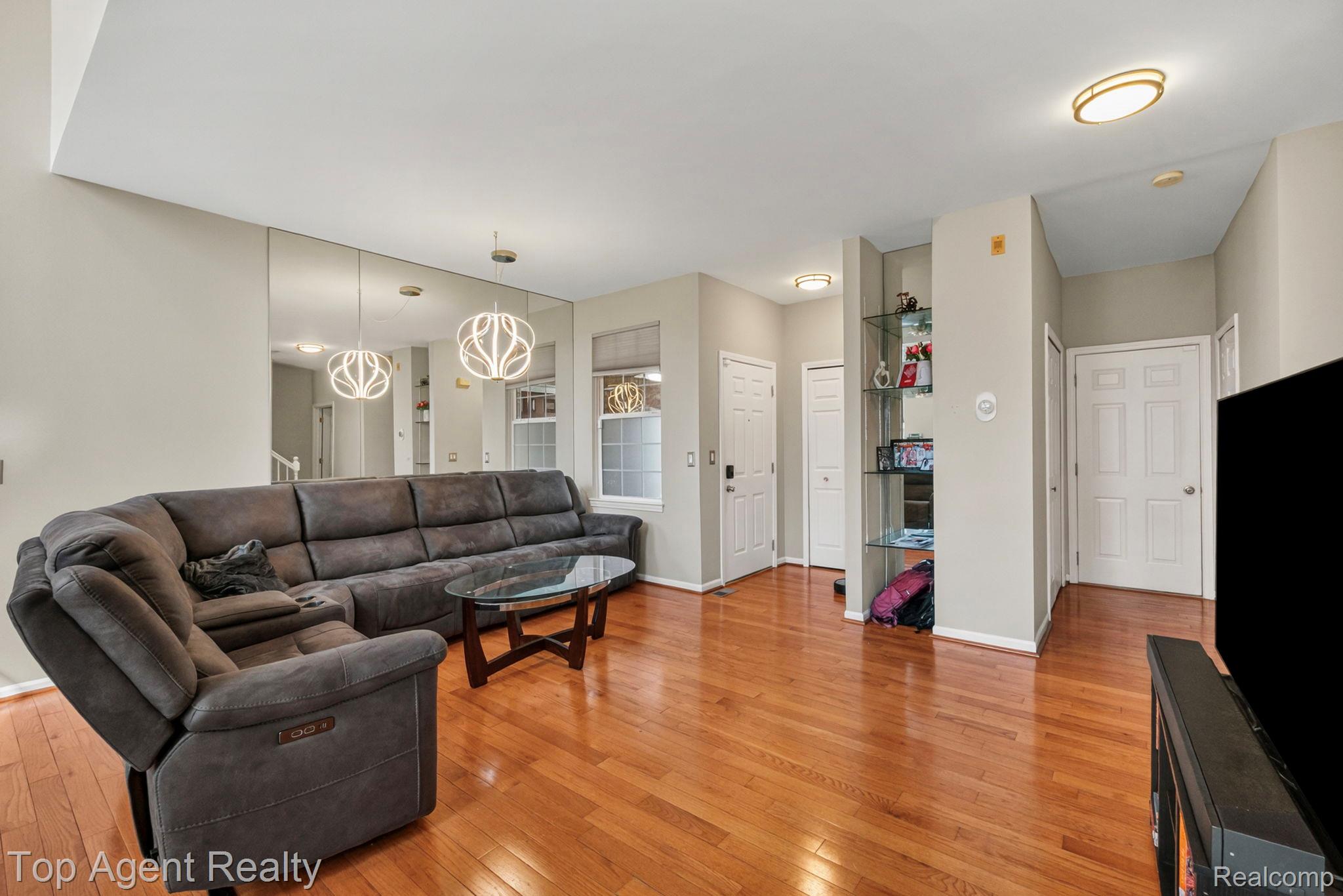 41567 Glade Road, Unit 20 Canton, MI 48187 - Photo 9 of 47 Living area featuring light wood finished floors