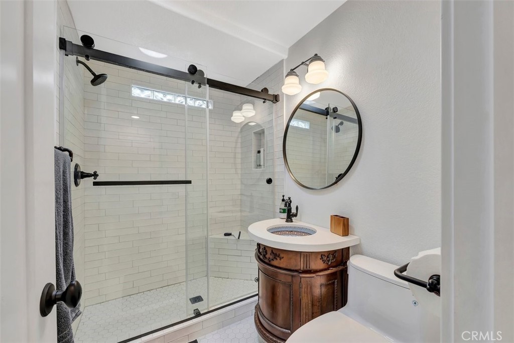 306 Avenida Monterey San Clemente, CA 92672 - Photo 17 of 41 a bathroom with a toilet a sink and a mirror