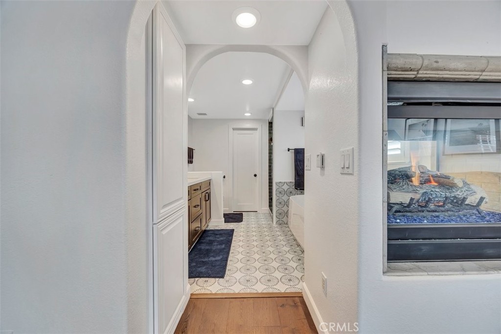 306 Avenida Monterey San Clemente, CA 92672 - Photo 22 of 41 a view of a hallway with wooden floor and a living room