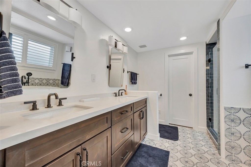 306 Avenida Monterey San Clemente, CA 92672 - Photo 25 of 41 a spacious bathroom with a double vanity sink mirror and