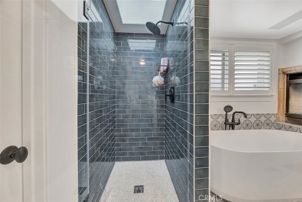 306 Avenida Monterey San Clemente, CA 92672 - Photo 26 of 41 a bathroom with a sink a window and shower