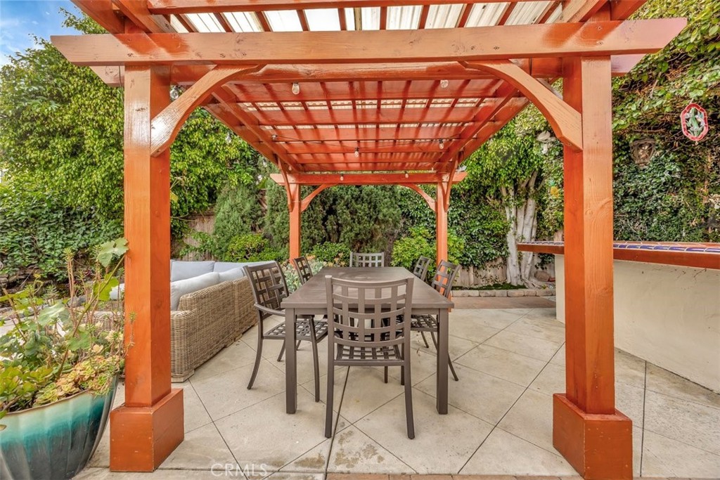 306 Avenida Monterey San Clemente, CA 92672 - Photo 31 of 41 a view of a patio with a table and chairs under an umbrella