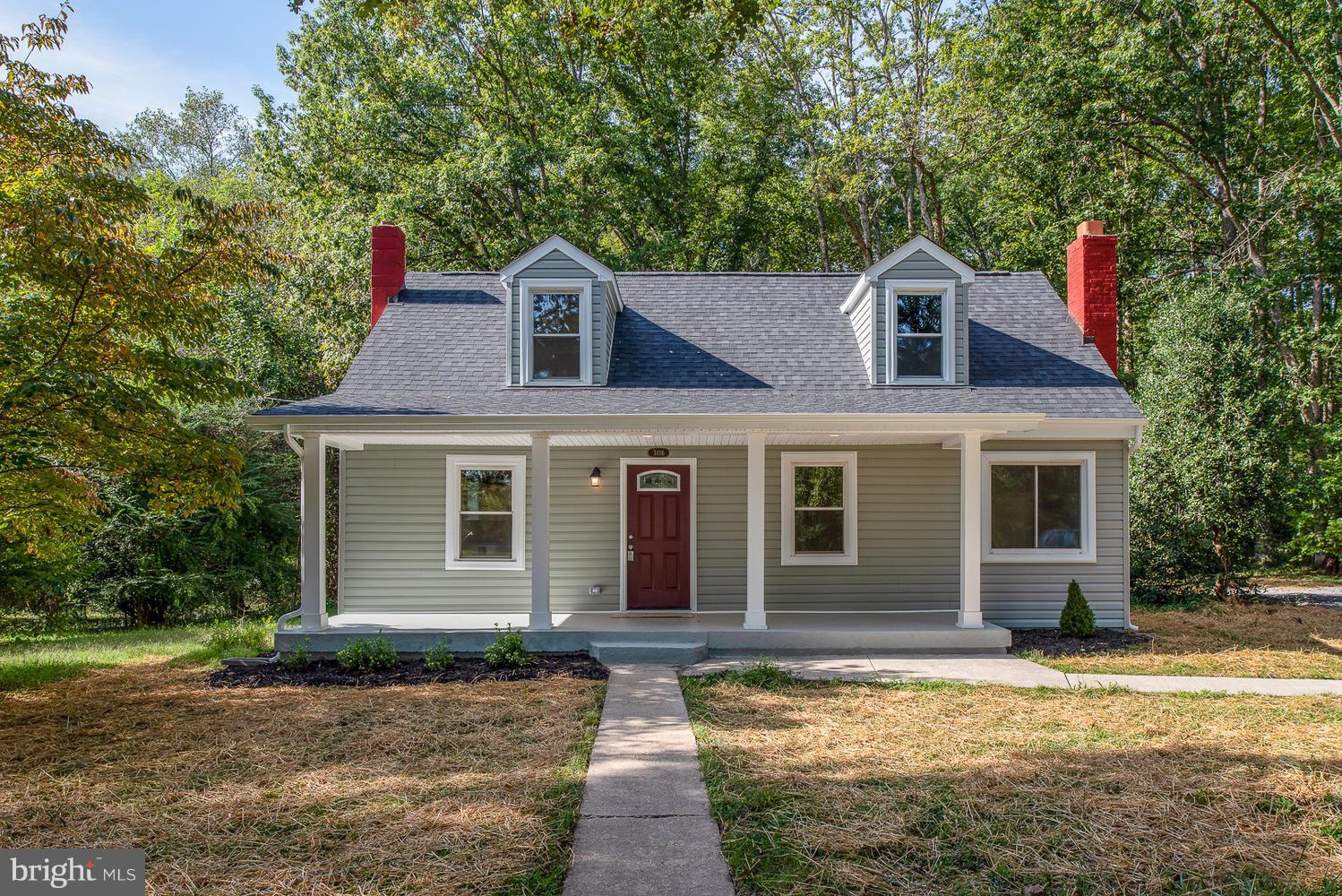 3116 Lewiston Road Bumpass, VA 23024 - Photo 1 of 27 a front view of a house with a yard