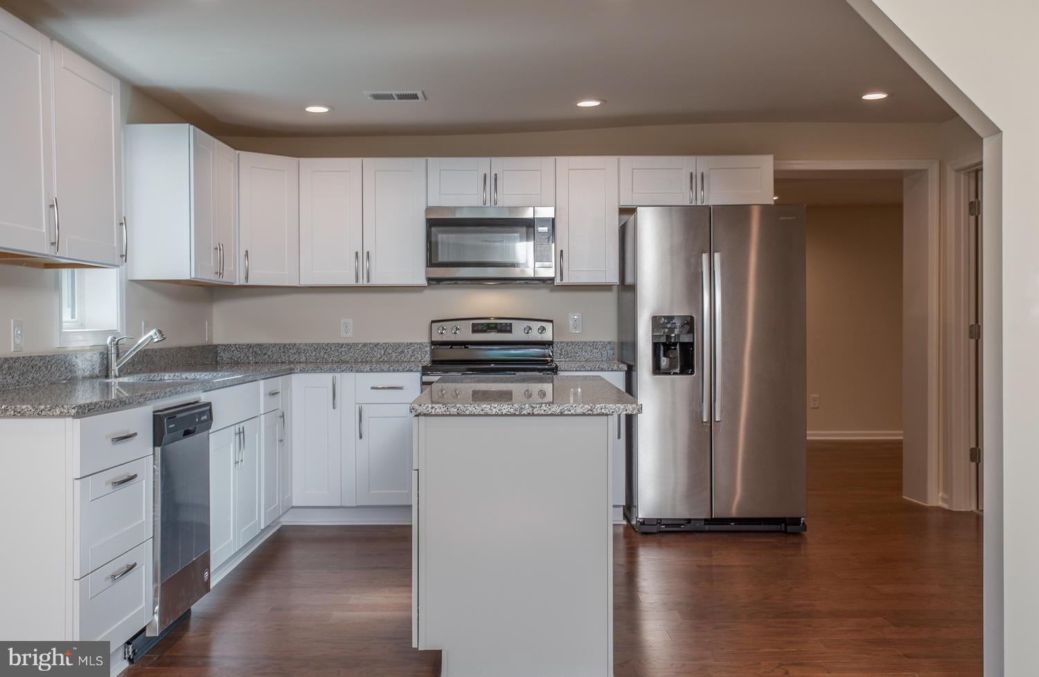 3116 Lewiston Road Bumpass, VA 23024 - Photo 2 of 27 a kitchen with stainless steel appliances a refrigerator sink and microwave