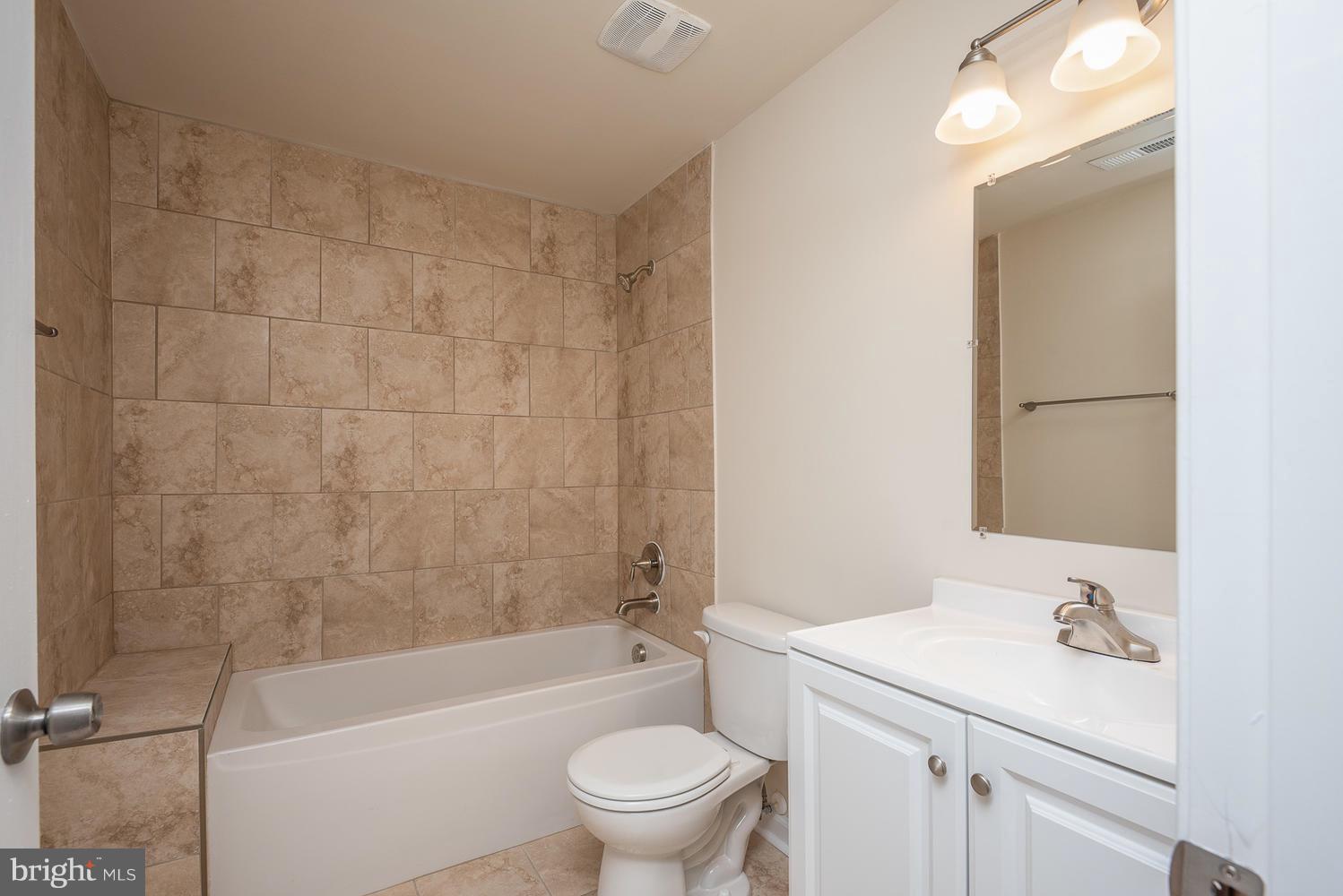 3116 Lewiston Road Bumpass, VA 23024 - Photo 12 of 27 a bathroom with a sink a toilet and a bathtub