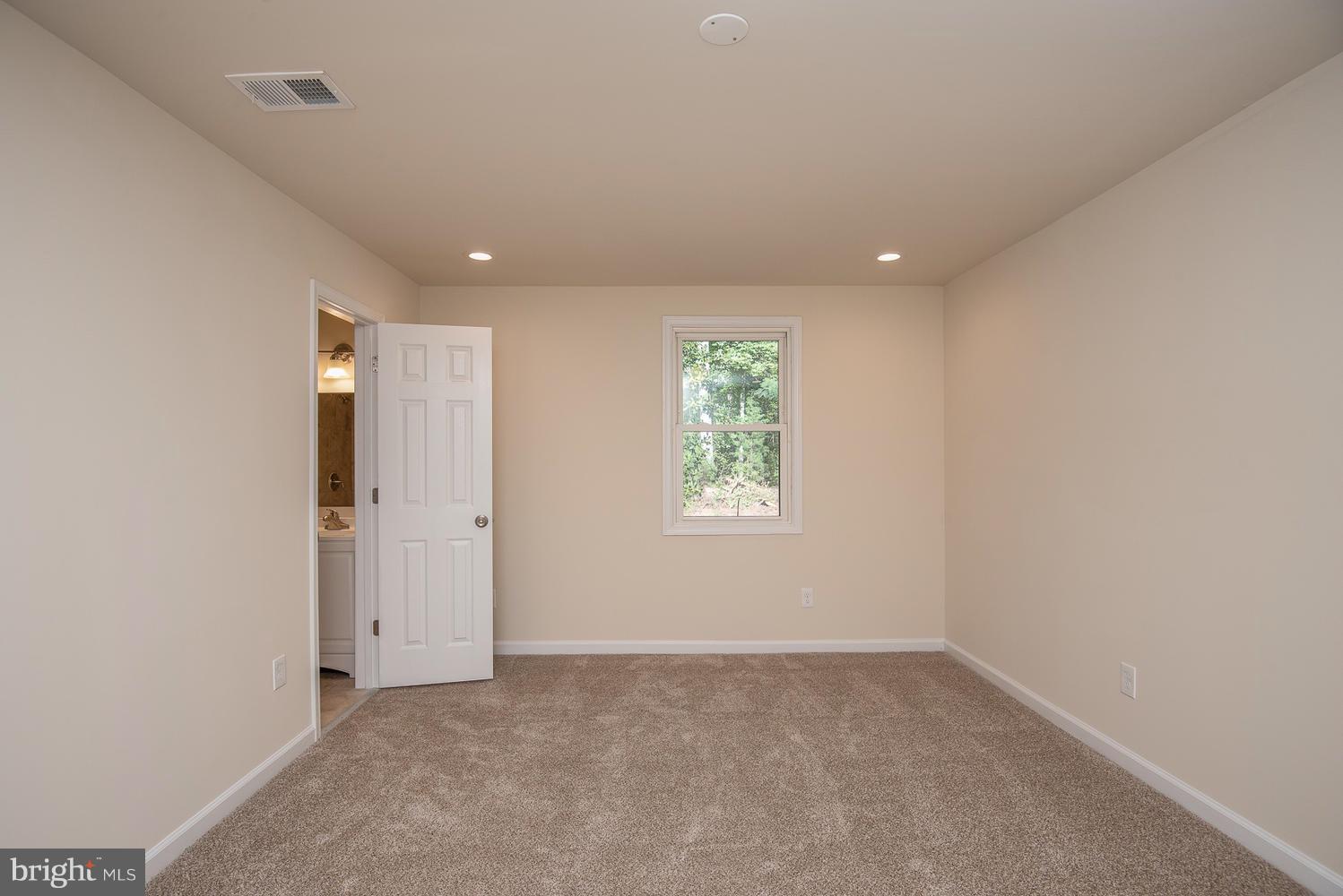 3116 Lewiston Road Bumpass, VA 23024 - Photo 14 of 27 an empty room with windows