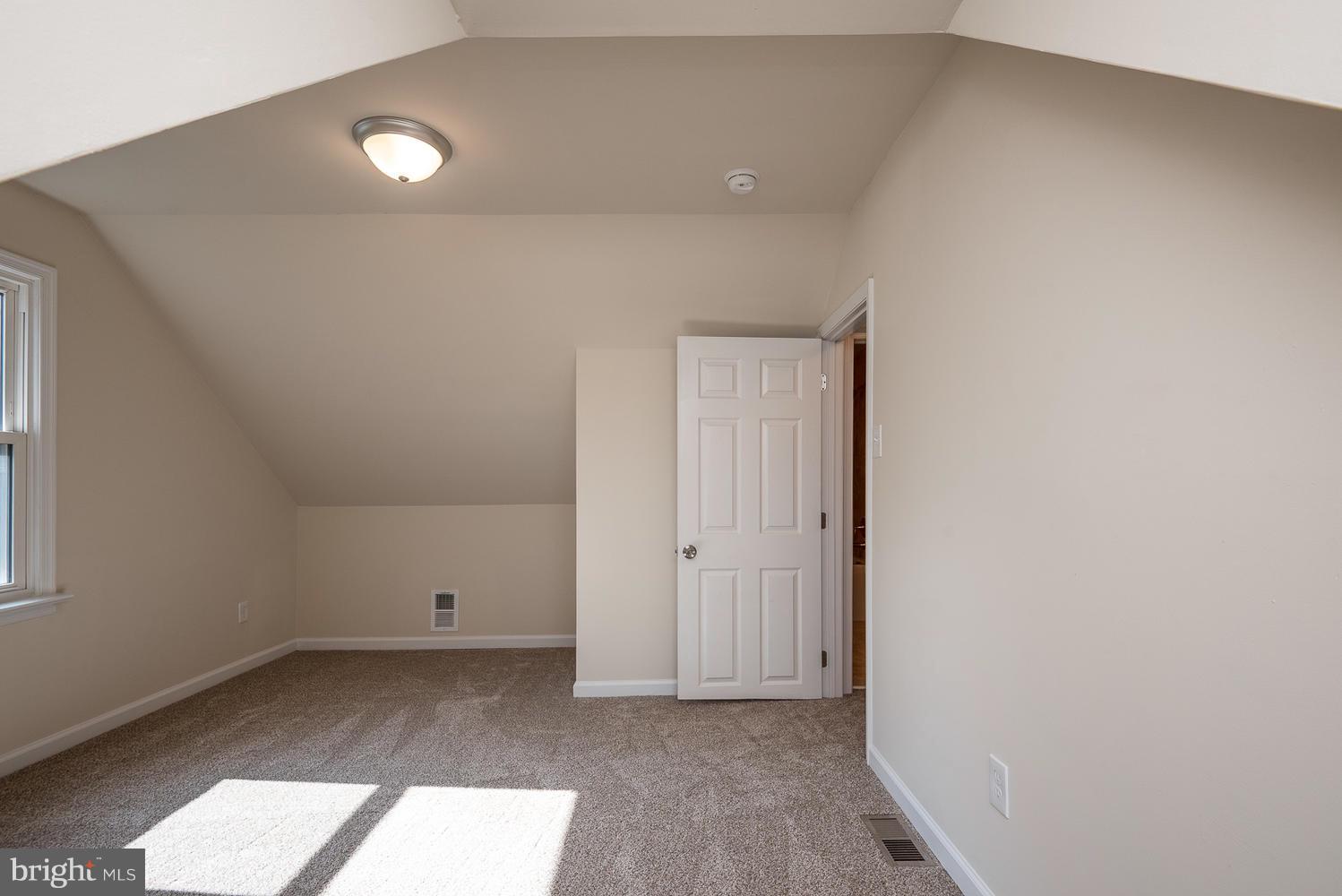 3116 Lewiston Road Bumpass, VA 23024 - Photo 20 of 27 an empty room with wooden floor and windows