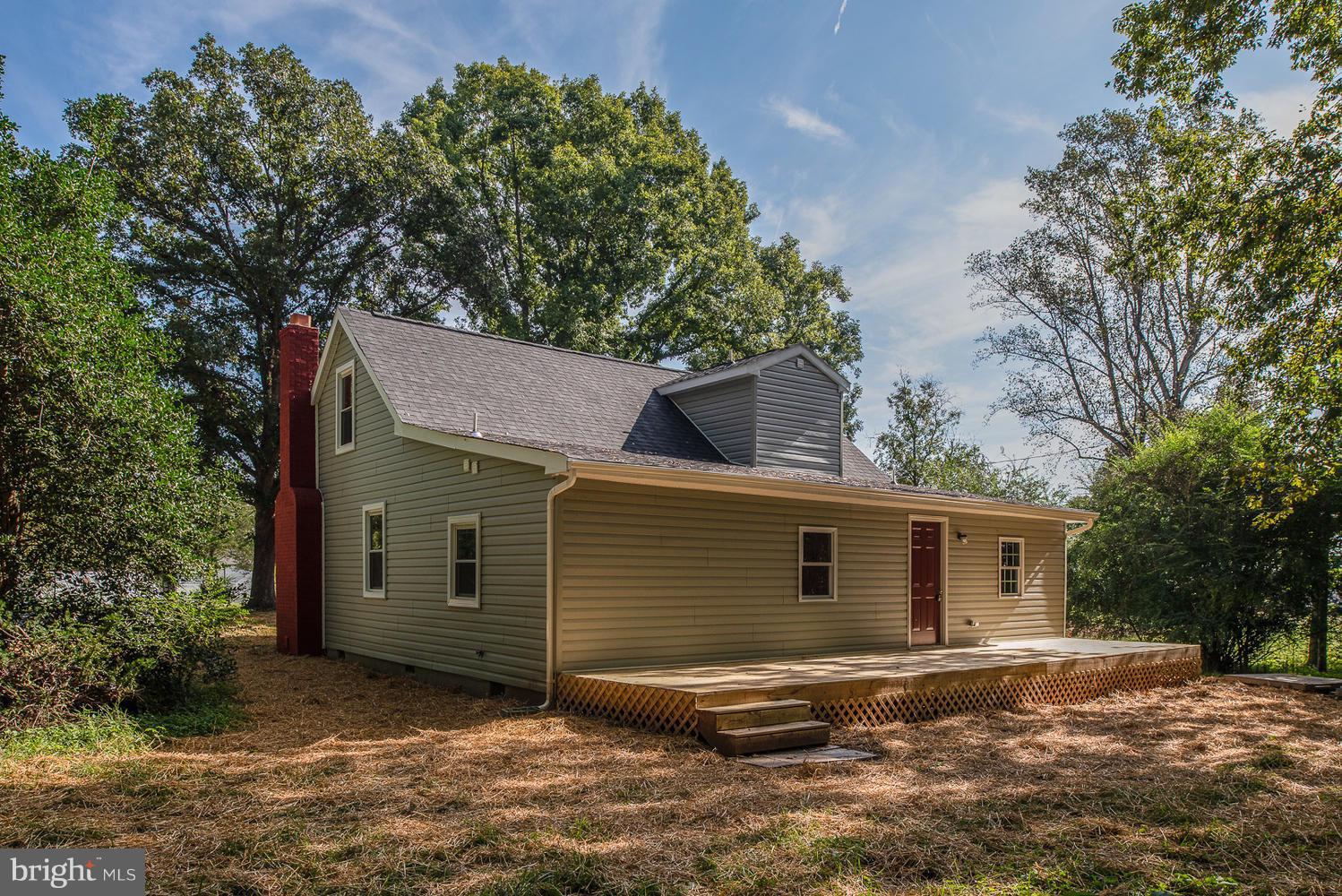 3116 Lewiston Road Bumpass, VA 23024 - Photo 25 of 27 a view of a house with a yard
