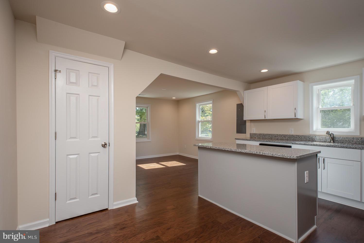 3116 Lewiston Road Bumpass, VA 23024 - Photo 4 of 27 a kitchen with granite countertop a sink cabinets and wooden floor