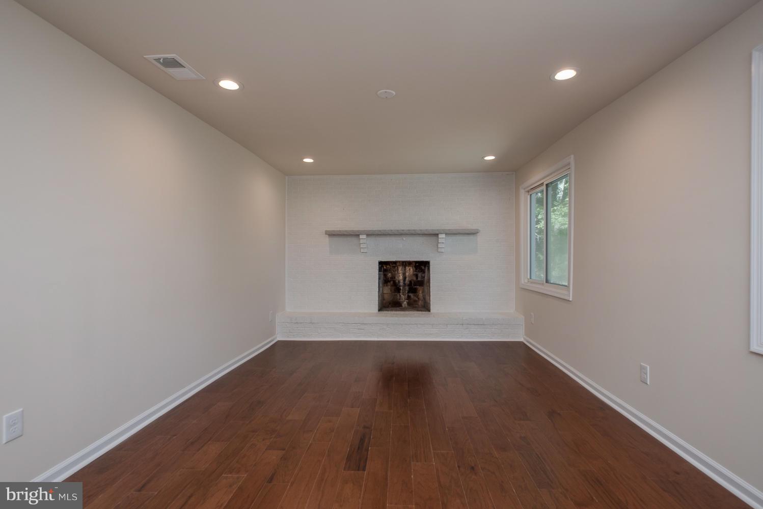 3116 Lewiston Road Bumpass, VA 23024 - Photo 7 of 27 wooden floor in an empty room with a window