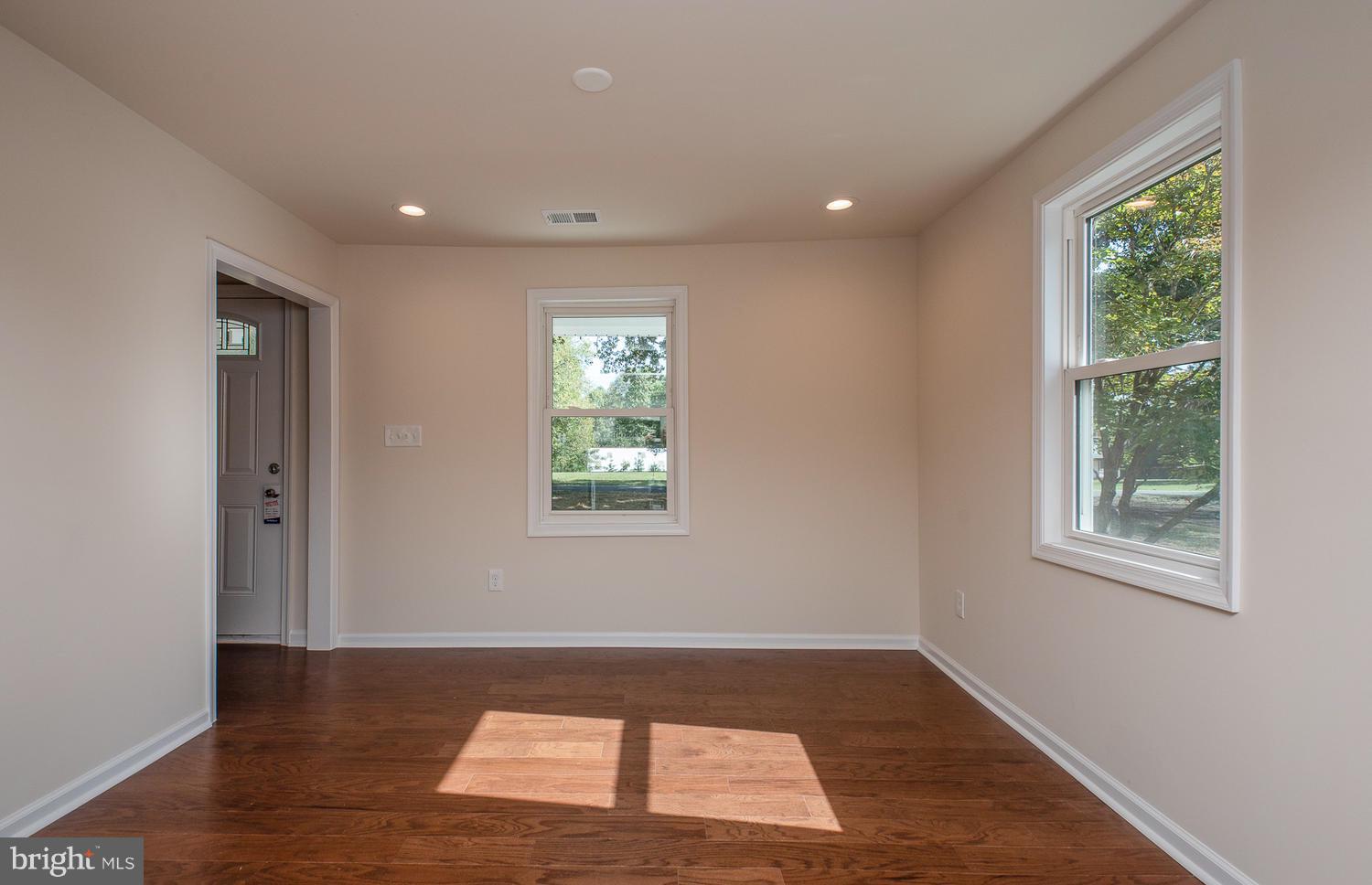 3116 Lewiston Road Bumpass, VA 23024 - Photo 9 of 27 a view of wooden floor and windows in a room