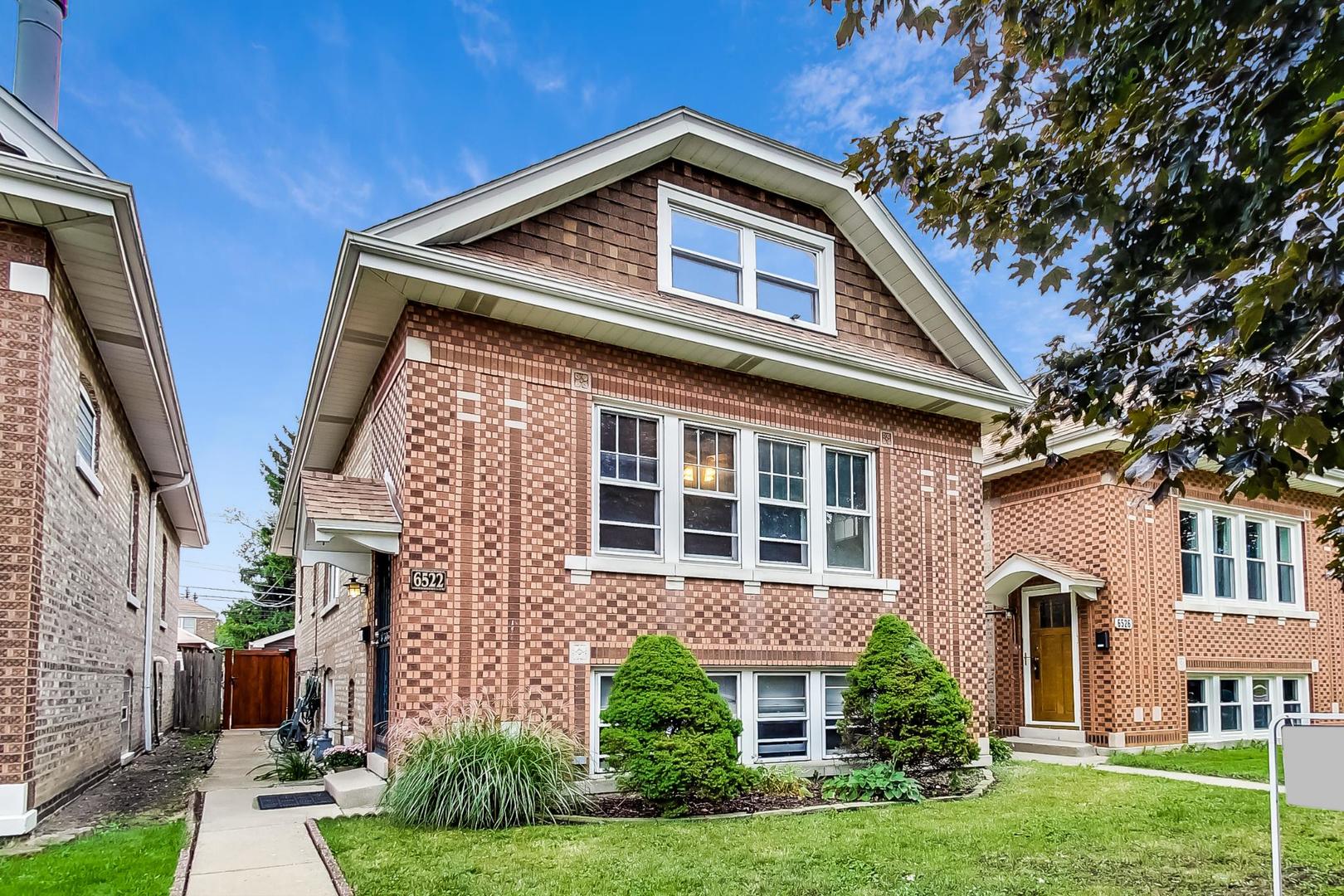 6522 28th Street Berwyn, IL 60402 - Photo 1 of 45 a front view of a house with garden