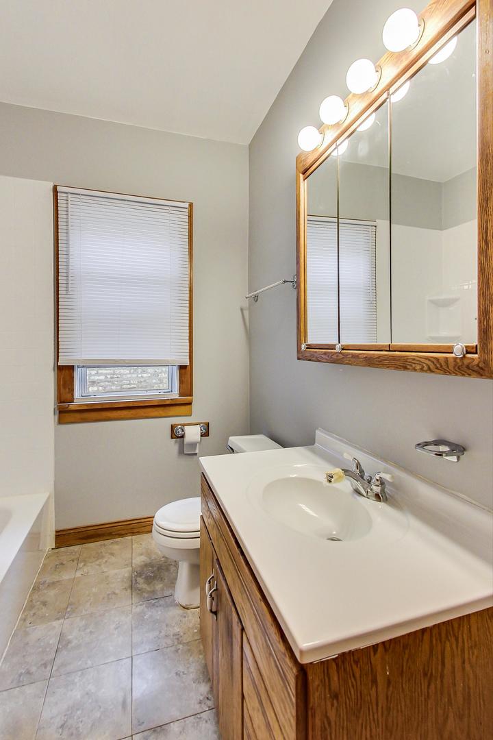 6522 28th Street Berwyn, IL 60402 - Photo 13 of 45 a bathroom with a sink toilet and mirror